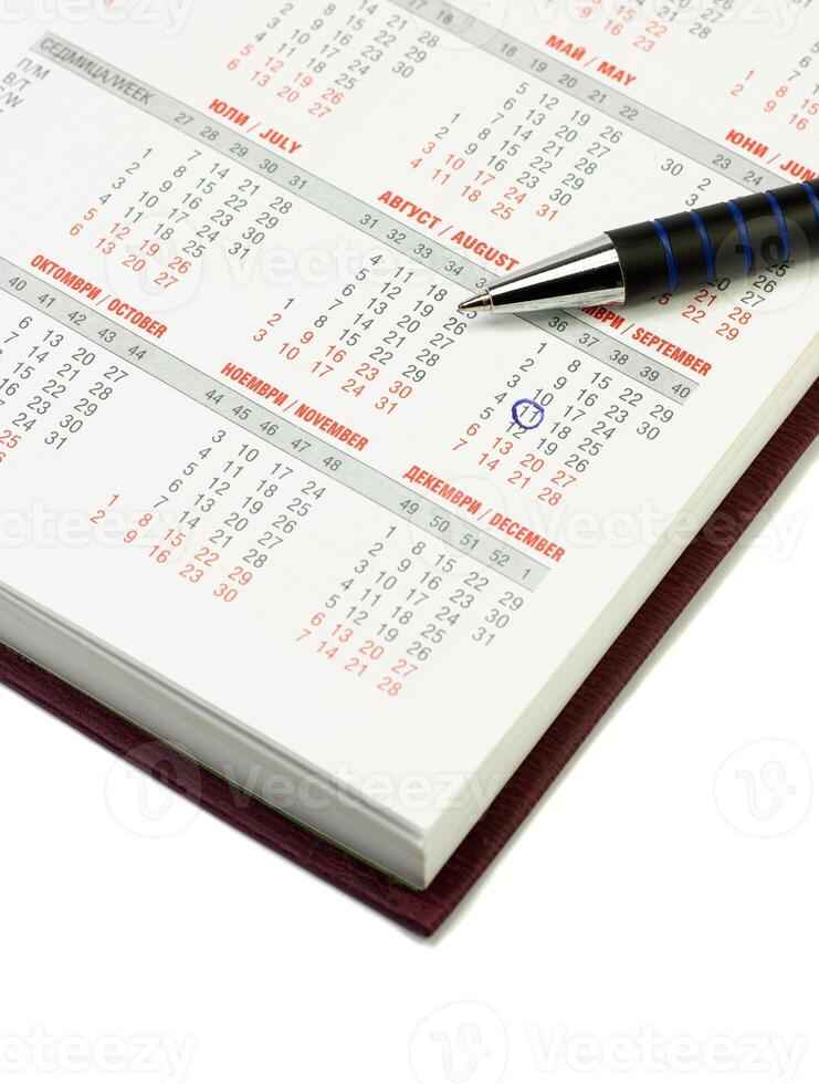 Kalender und Stift foto