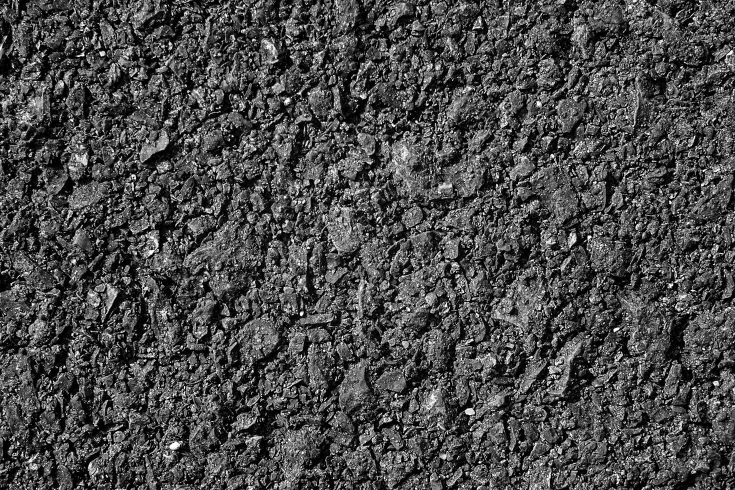 dunkel Textur Einzelheiten von Oberfläche von Asphalt oder Tamak auf Neu Straße, Hintergrund oder Hintergrund, meterial cpncept Design foto