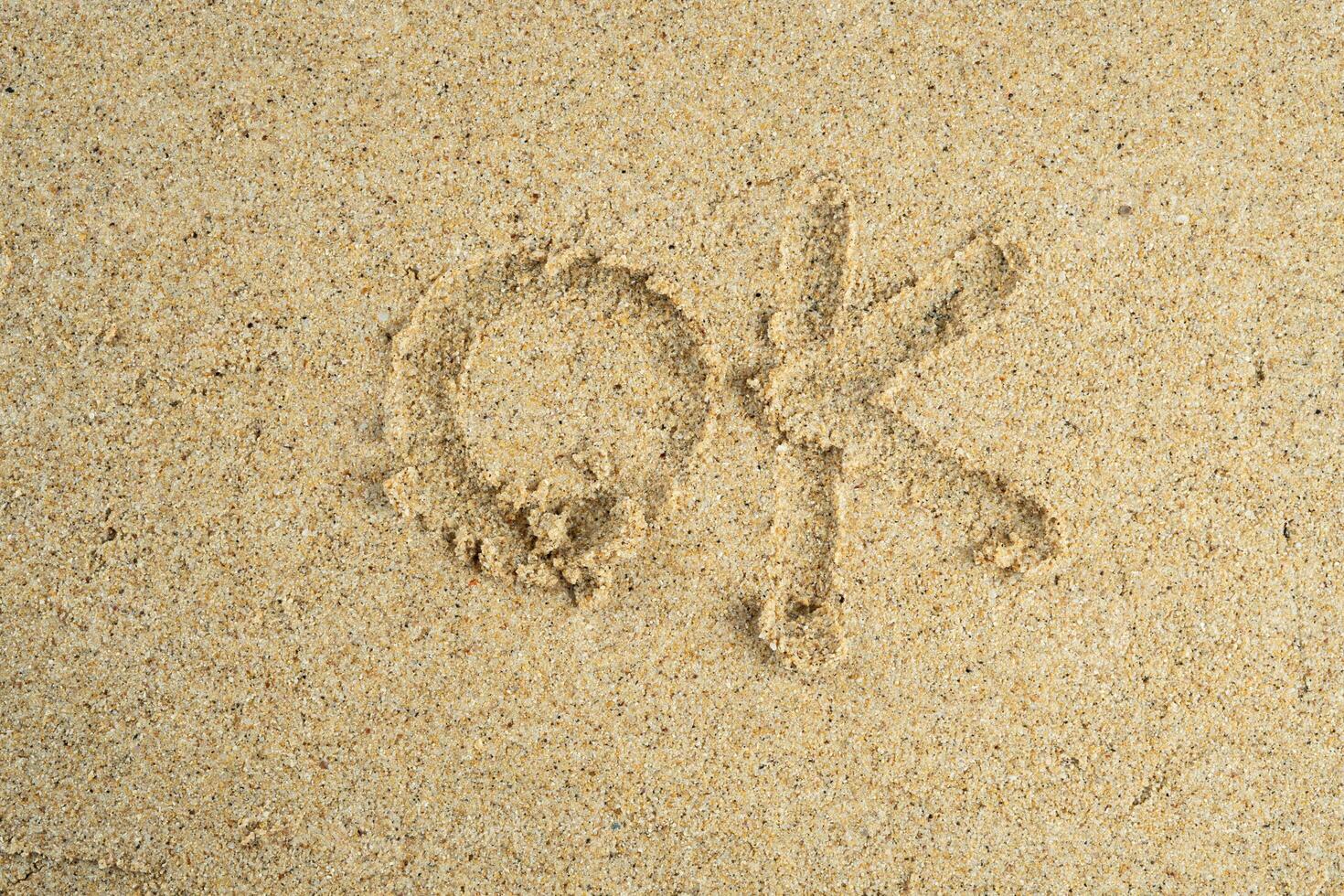 Sand mit in Ordnung Text foto