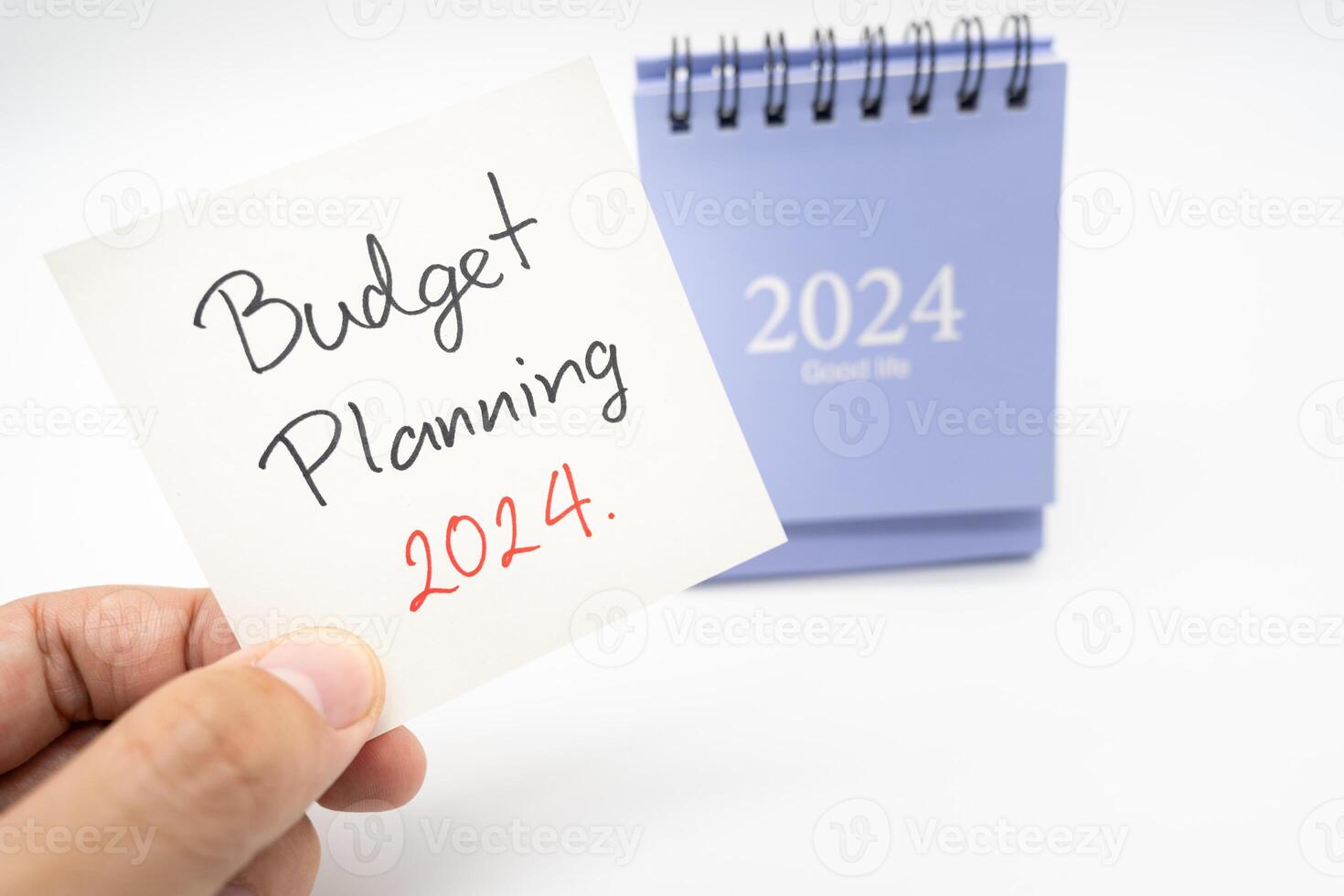 Budget Planung 2024 Text Botschaft durch Hand Schreiben auf Papier Hinweis und Kalender 2024. Budget Planung Konzept. isoliert auf Weiß Hintergrund. foto