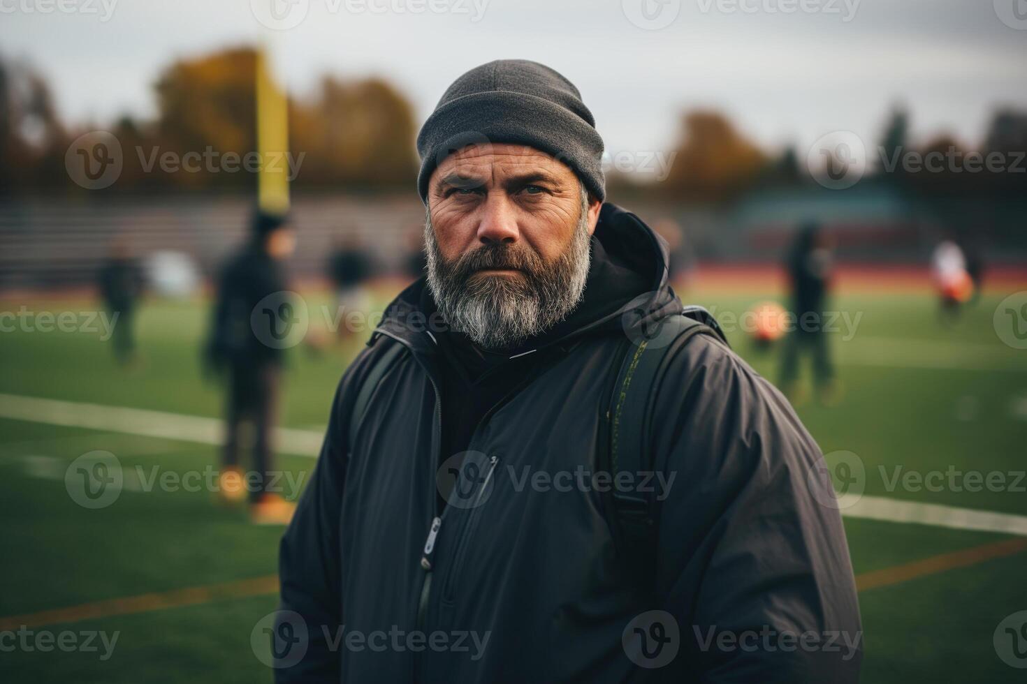 ai generiert ernst männlich Lehrer beim Mannschaft Ausbildung beim ein draussen Stadion, Porträt von ein Fußball Trainer auf das Sport Feld foto