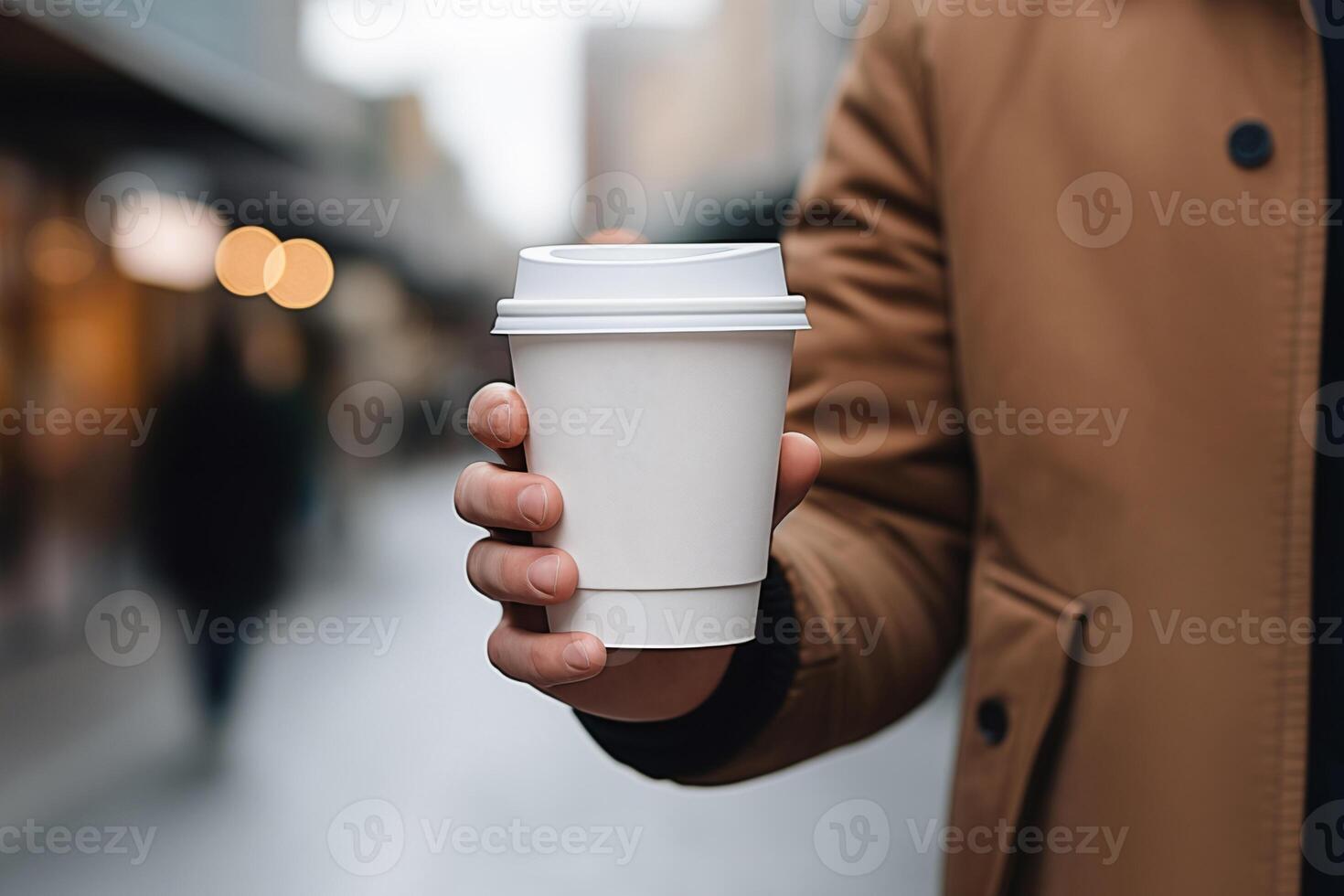 ai generiert schließen oben von Hand halten leer Weiß Papier Tasse Attrappe, Lehrmodell, Simulation auf verschwommen Straße Hintergrund foto