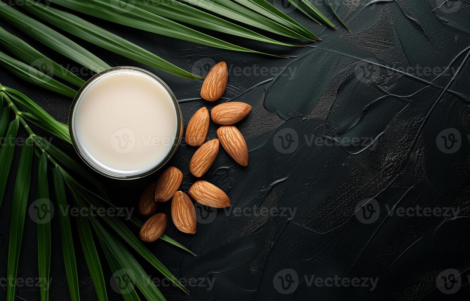 ai generiert Mandeln und Krug von Milch auf schwarz Hintergrund mit Grün Palme Blätter foto