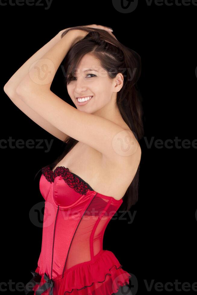 jung kaukasisch Frau lächelnd im rot Korsett foto
