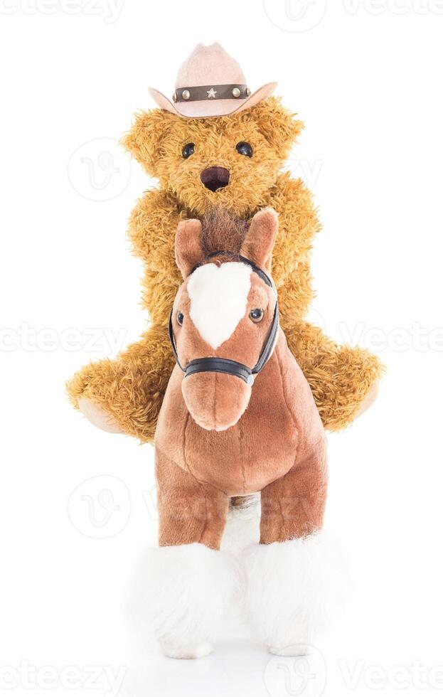 Cowboy-Teddybär auf einem Pferd foto