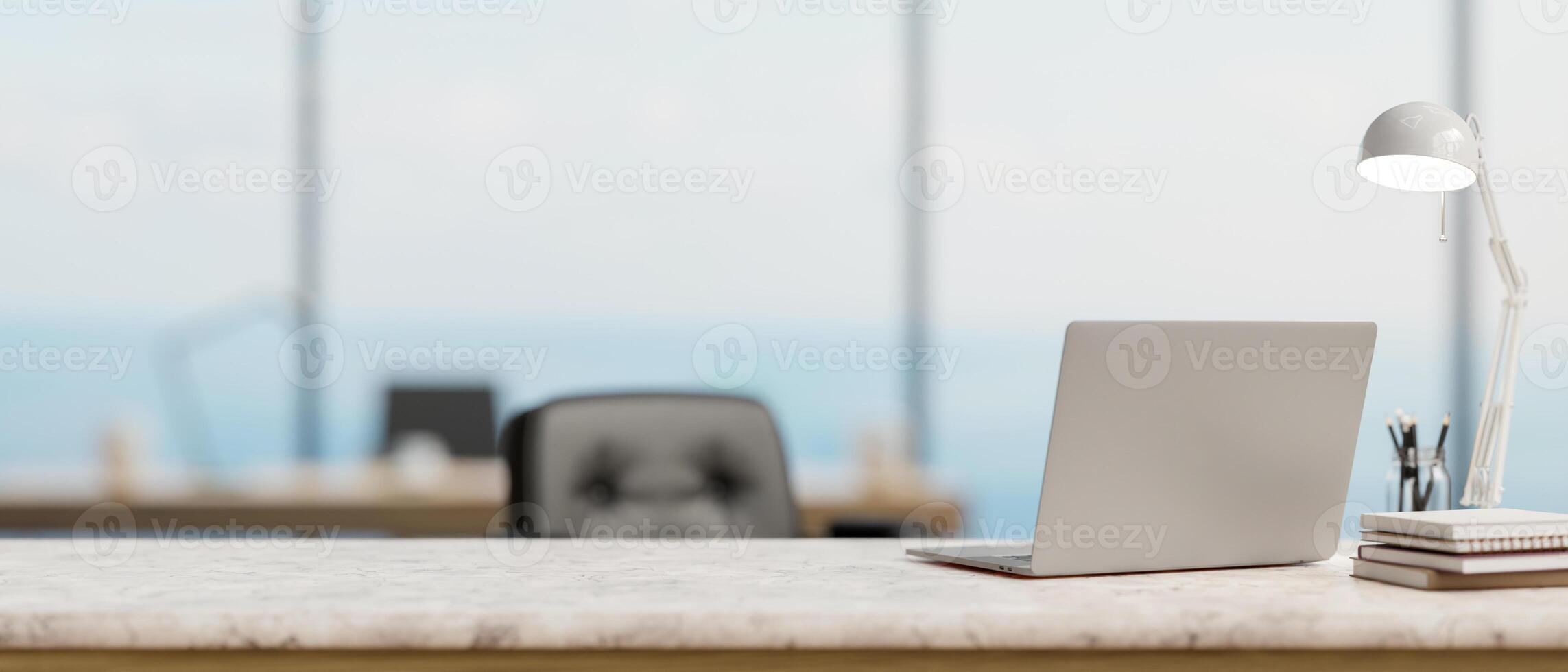 ein zurück Aussicht Bild von ein Laptop Computer auf ein Weiß Marmor Schreibtisch im ein modern geräumig Büro. foto