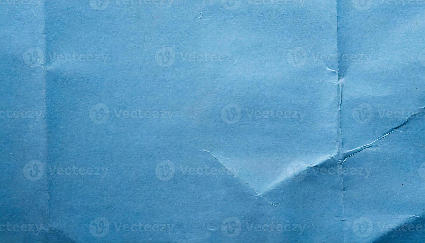 ein Blau Stück von Papier mit ein Loch im es foto