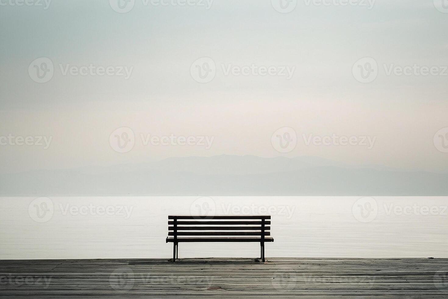 ein Bank Sitzung auf ein Dock mit Blick auf das Ozean foto