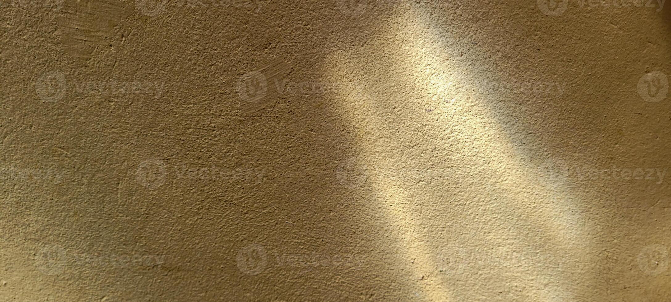 hellgelber und goldener Hintergrund mit Schatten foto