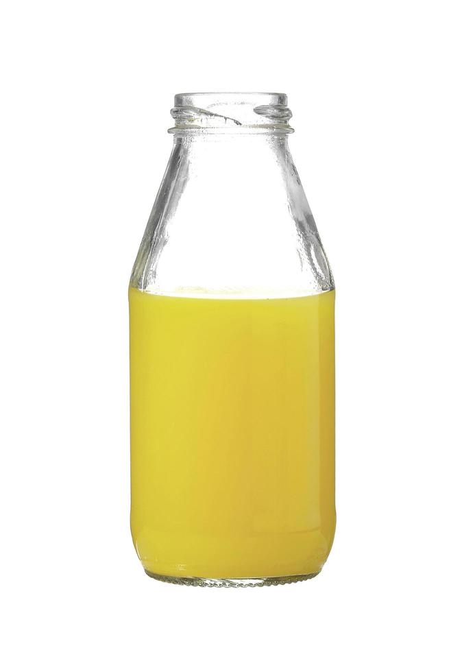 Ananassaft in Glasflasche auf weißem Hintergrund foto