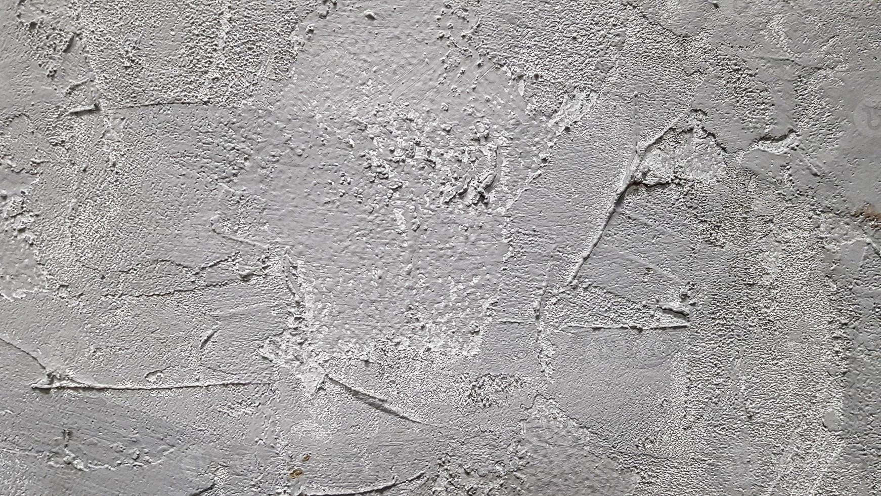 Textur aus grauem Zierputz oder Beton. abstrakter Hintergrund für Design. dekorativer Putzeffekt an der Wand. foto