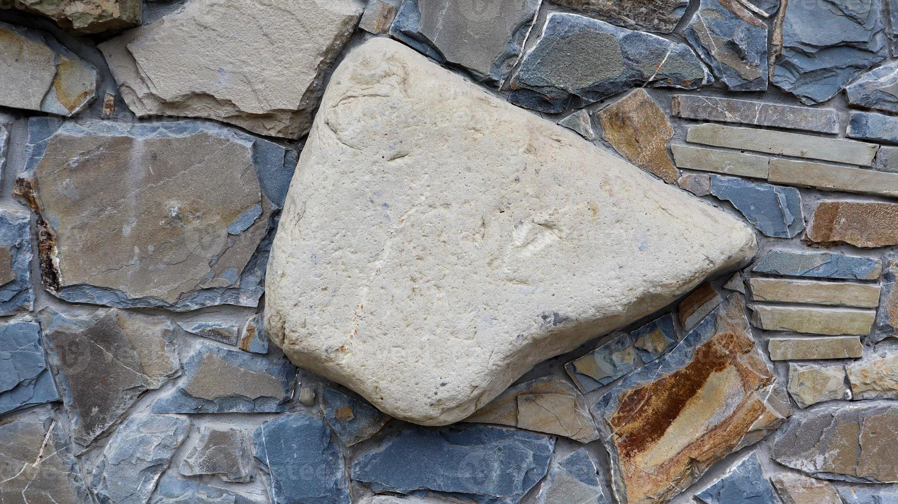 die Beschaffenheit der Steinmauer. Alte Burg Steinmauer Textur Hintergrund. Steinmauer als Hintergrund oder Textur. Teil einer Steinmauer, für Hintergrund oder Textur. Muster graue Farbe modernes Design foto