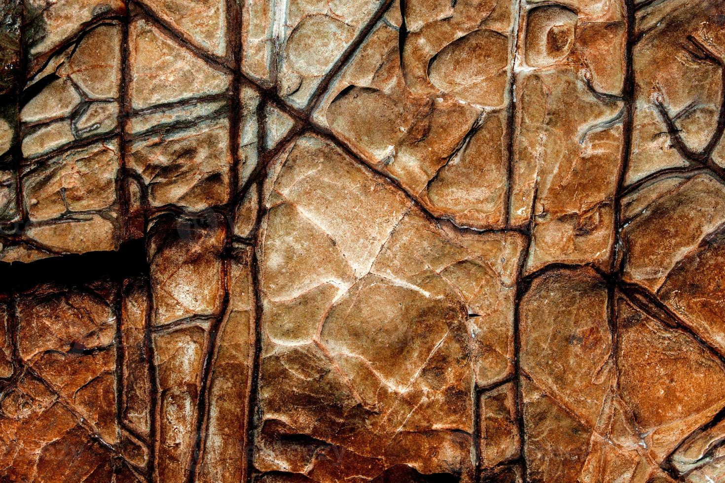 Orange Rock Stein Textur isoliert und riesige Sammlung von Granitsteinen Hintergrund foto
