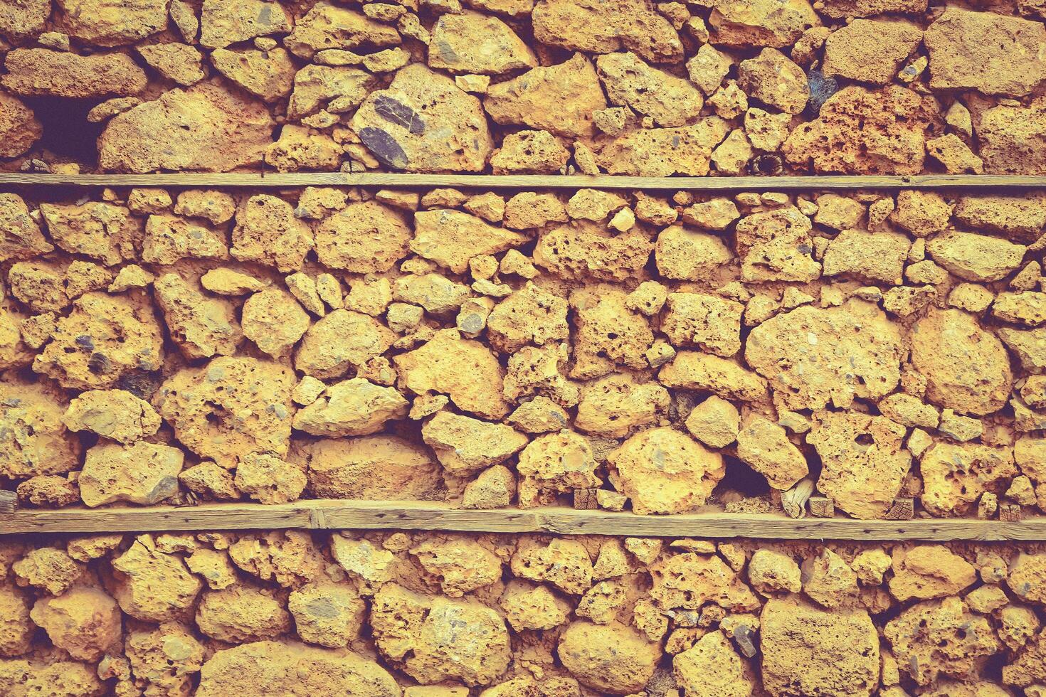 abstrakte gelbe Steinwand realistische Textur Ornament Gebäude Rock auf Naturmuster hell. foto