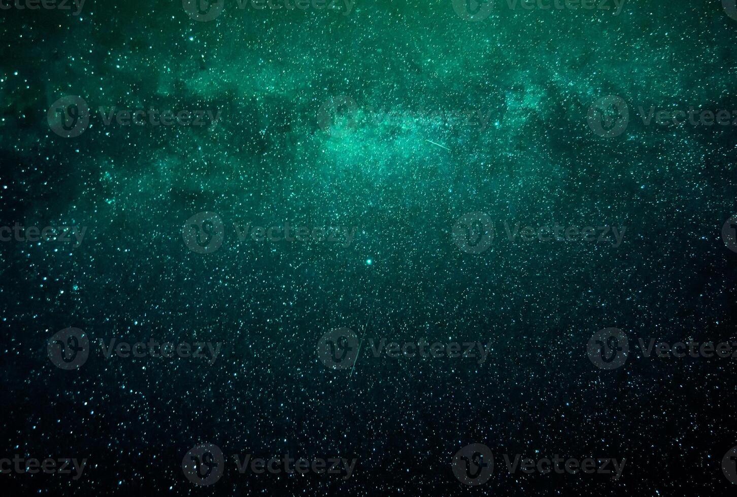 abstrakter Galaxiehintergrund mit Sternen und Planeten mit grünen und blauen Galaxienmotiven des Nachtlichts des Universums foto