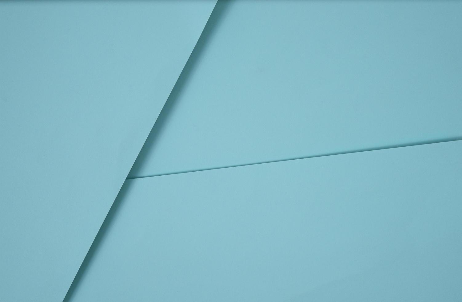 abstrakter Pop-up-Papierhintergrund in Blau. abstrakte Arrangements bilden eine geometrische Textur für Tapeten, Poster, Flyer usw. foto