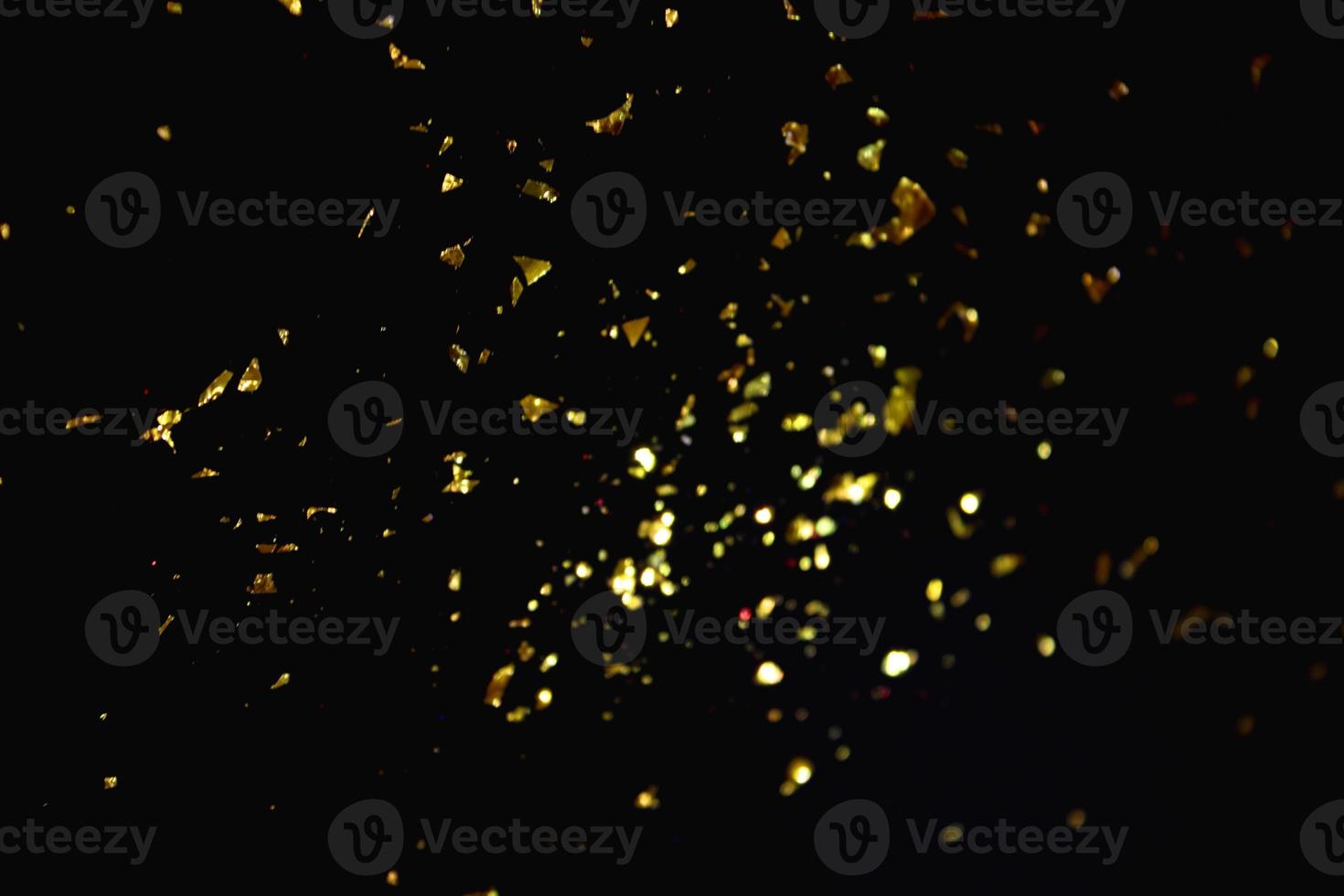 Gold abstrakte Muster Glitter Stardust funkelnde Lichter Grunge auf Schwarz. foto