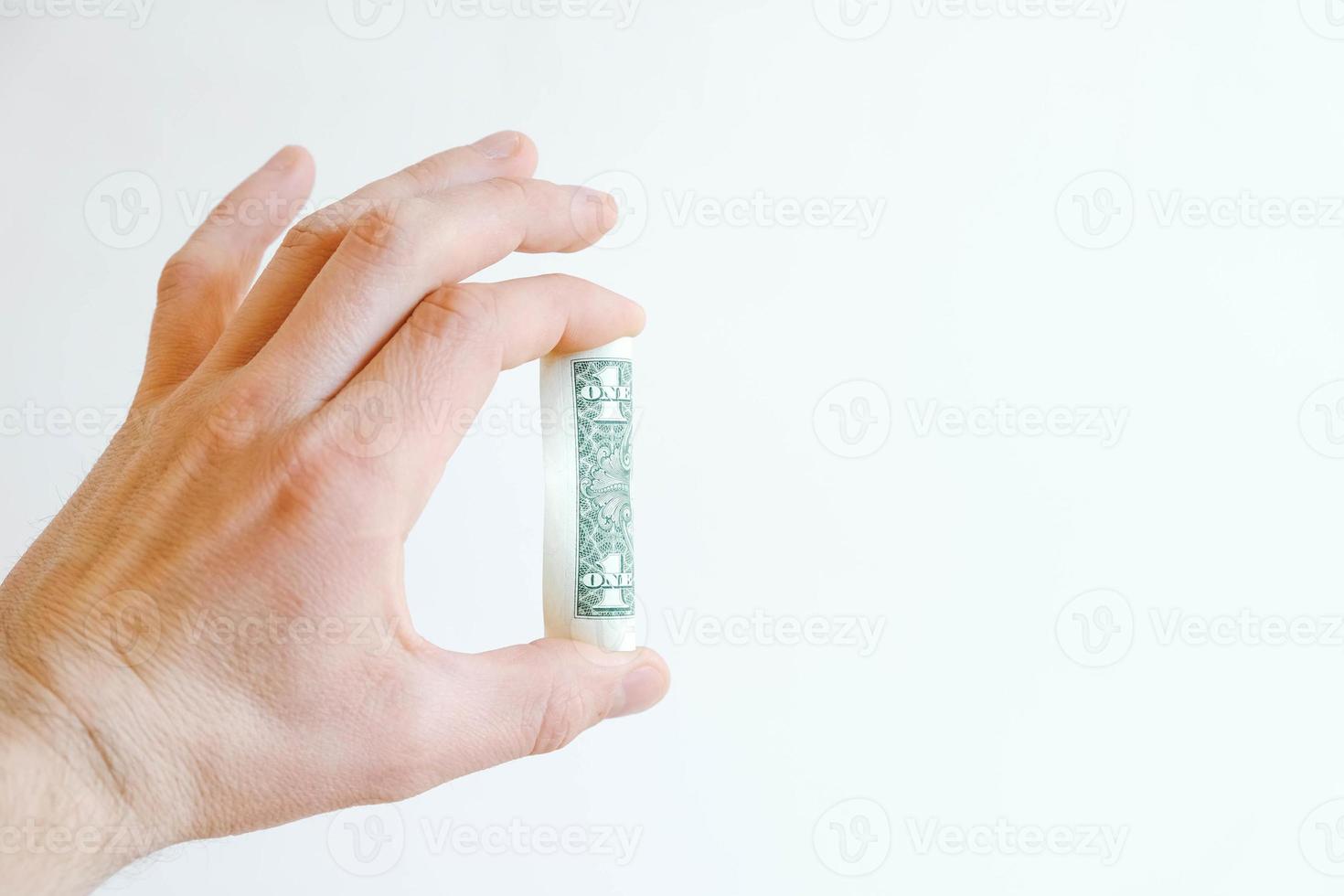 ein Dollar in der Hand auf weißem Hintergrund foto