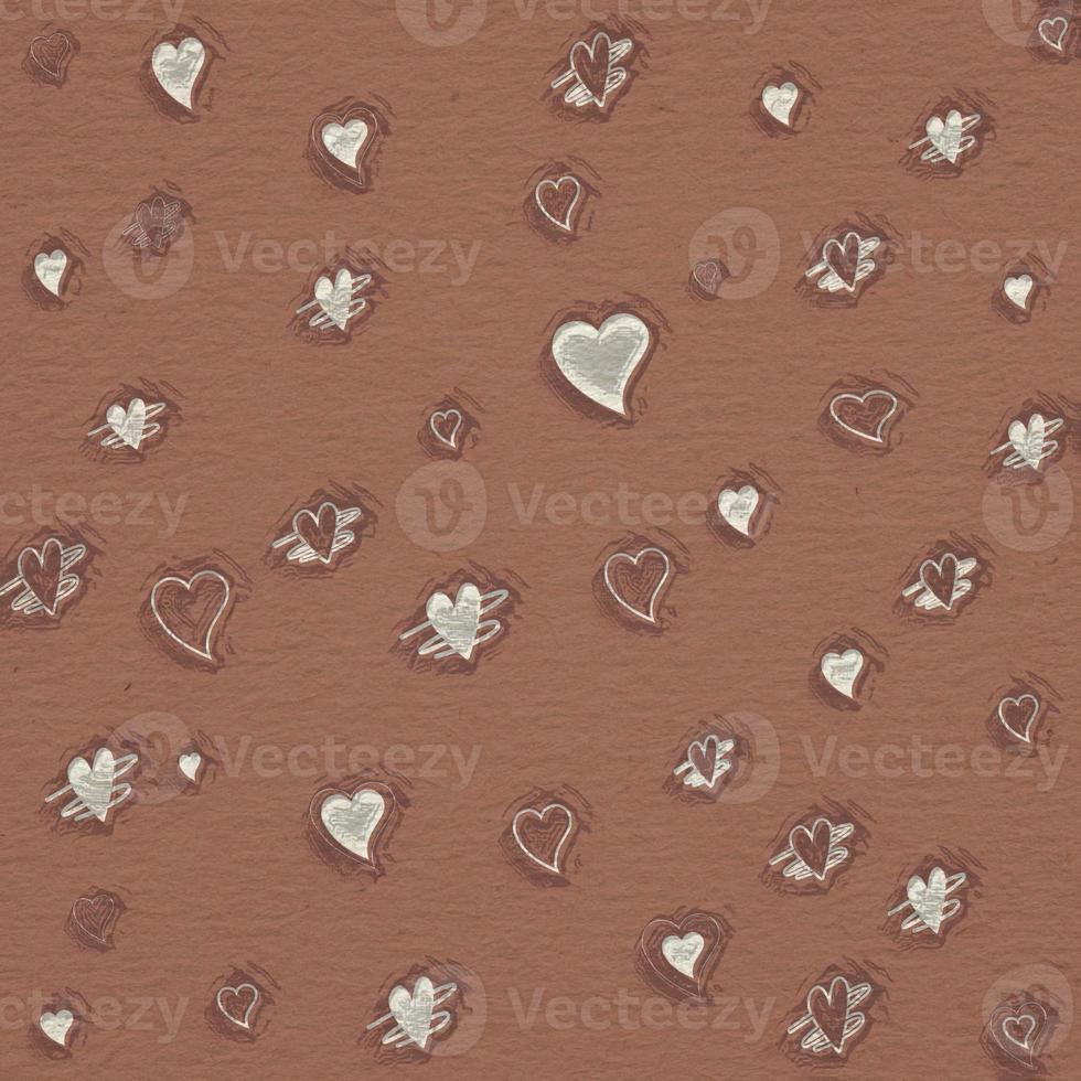 niedliche mini-herzform auf dem texturpapierhintergrund für valentinstag und minimalistische liebeskarte. foto