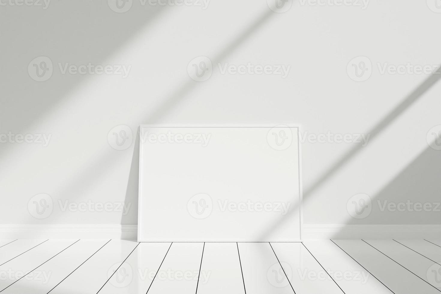 minimalistisches und sauberes horizontales weißes Poster oder Fotorahmen-Modell auf dem Boden, das sich mit Schatten an die Raumwand lehnt foto