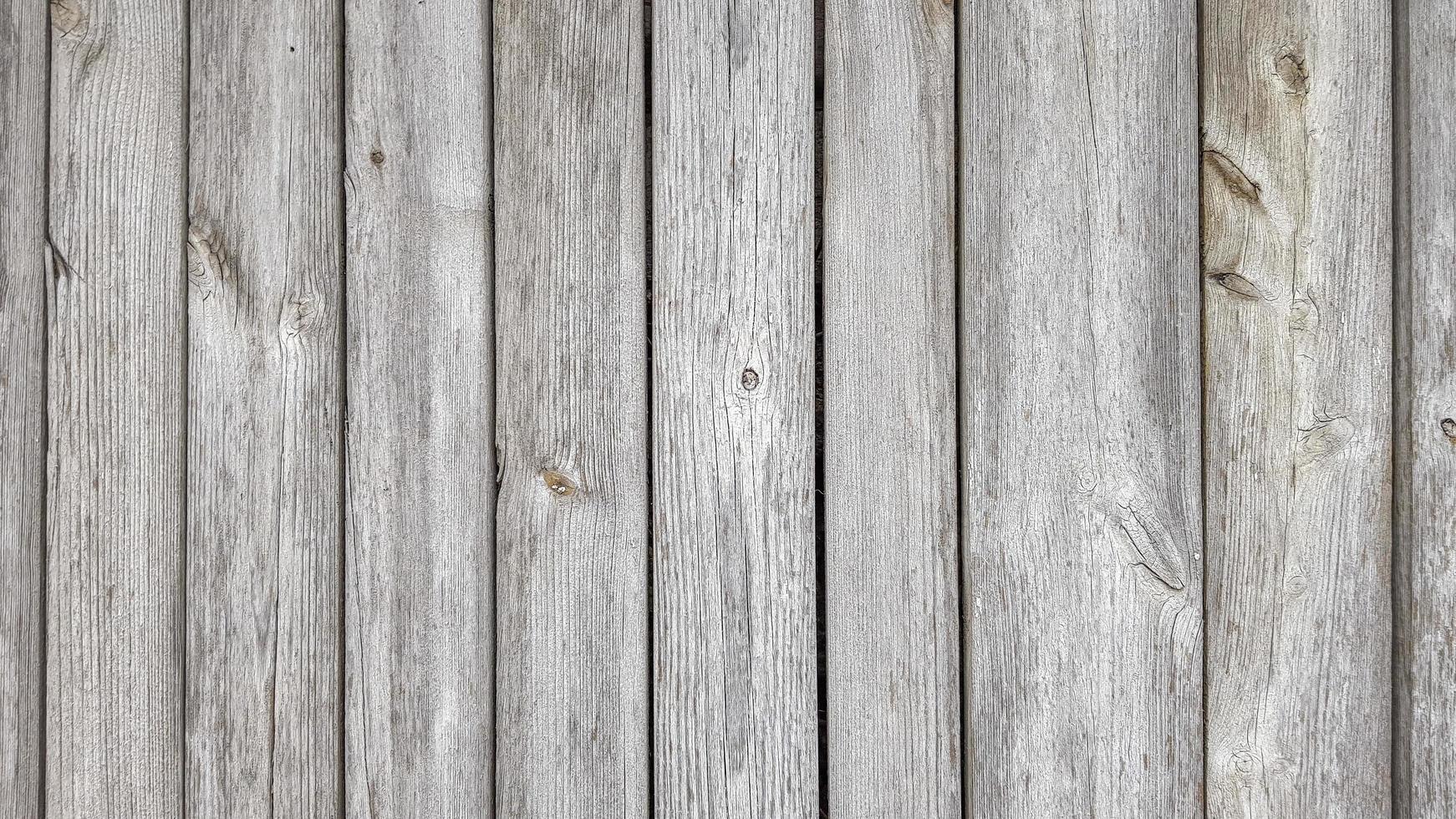 Grunge Plank Holzstruktur Hintergrund. Nahaufnahme von grauen Holzzaunplatten foto