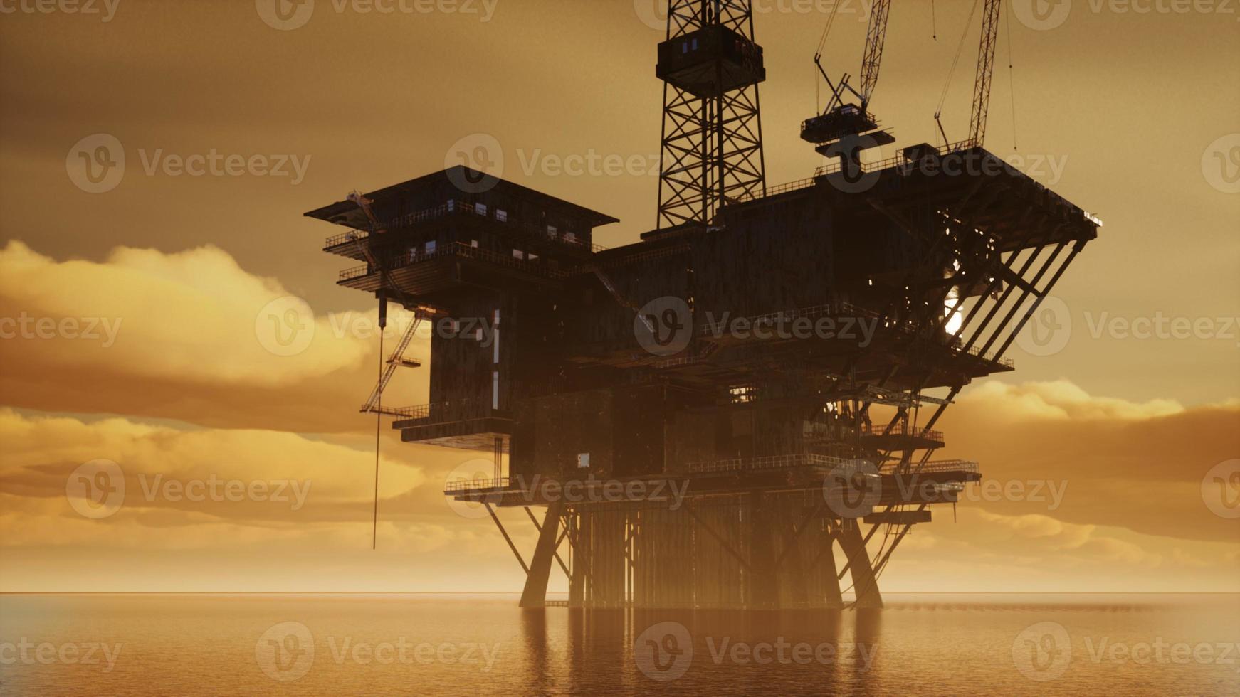 Offshore-Jack-Up-Rig mitten im Meer bei Sonnenuntergang foto