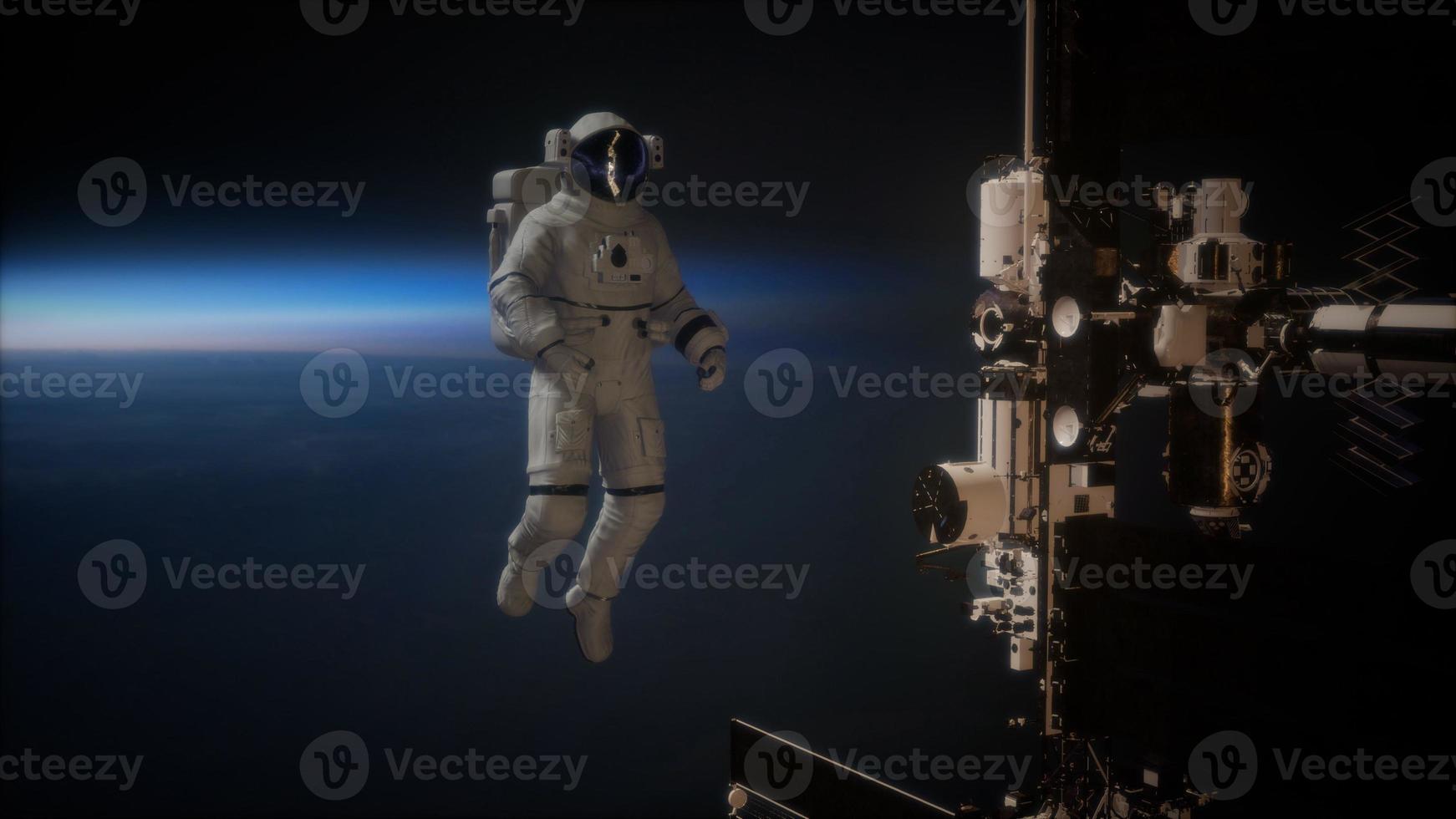 Internationale Raumstation und Astronaut im Weltraum über dem Planeten Erde foto