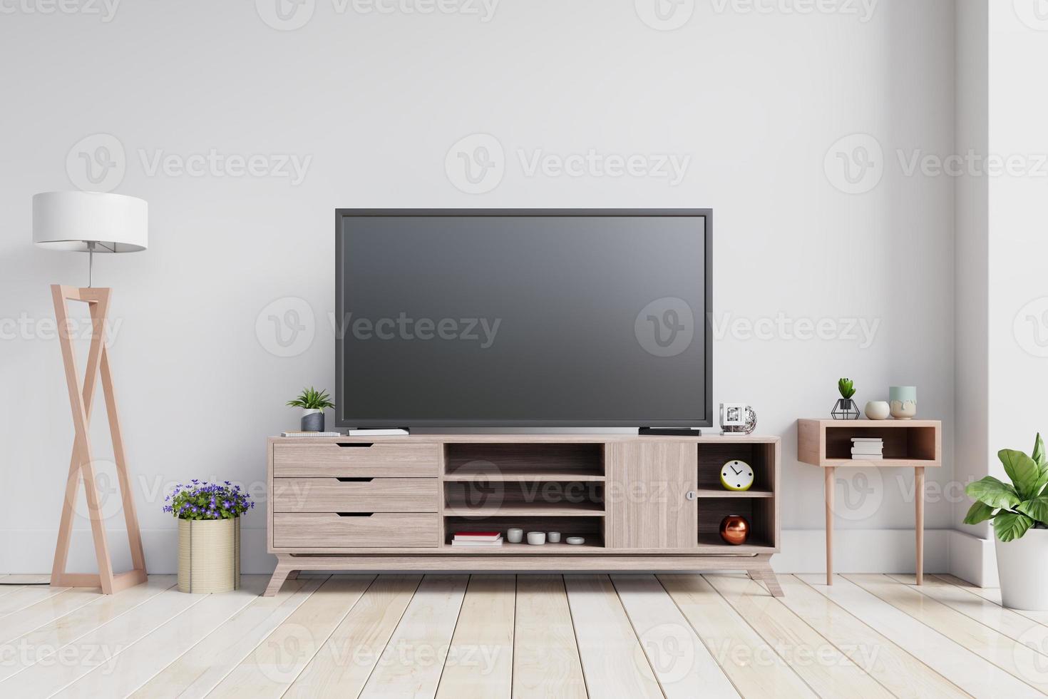 tv auf dem schrank im modernen wohnzimmer auf weißem wandhintergrund. foto