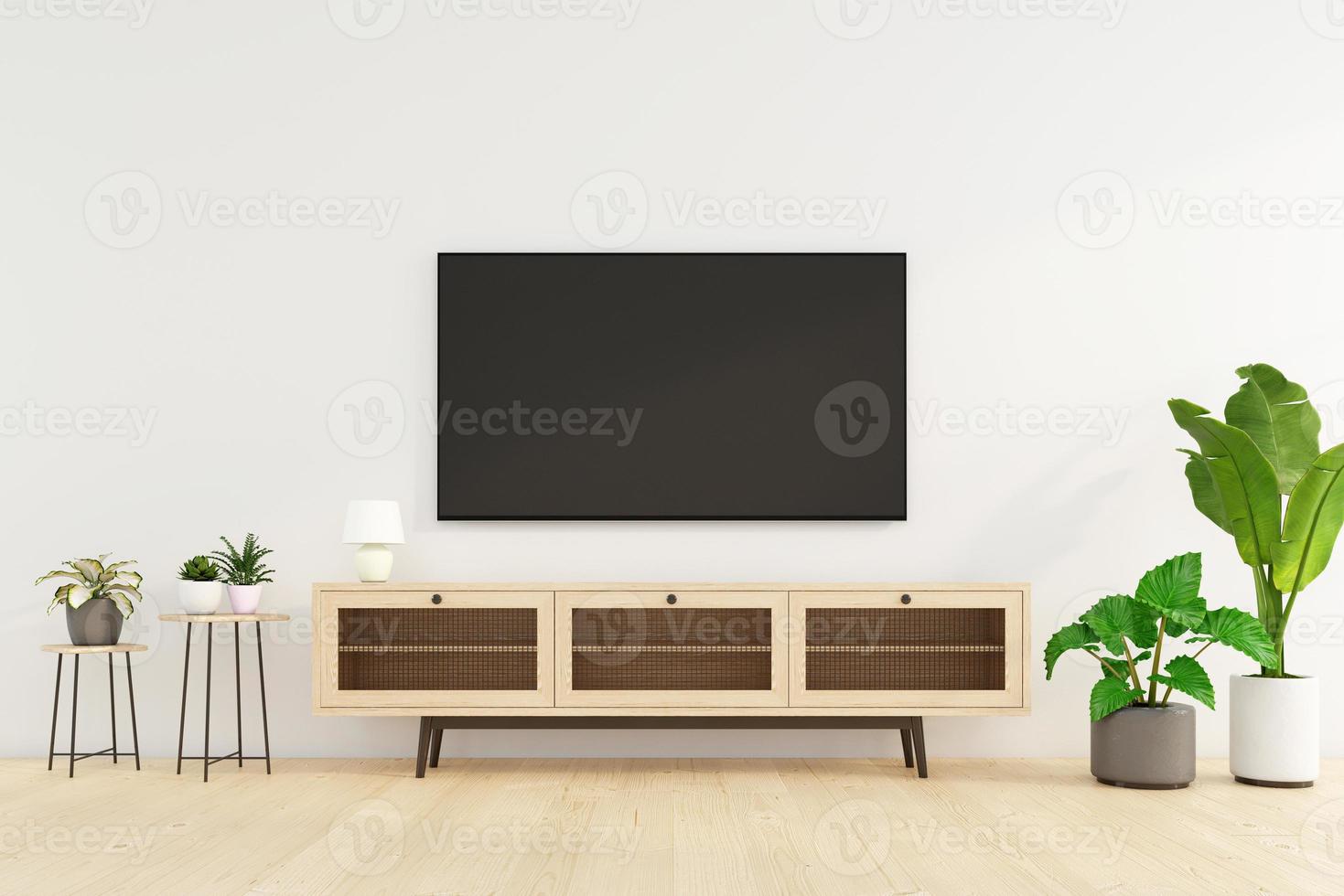 minimalistisches wohnzimmer mit tv-schrank und beistelltisch, weißer wand und grüner pflanze. 3D-Rendering foto