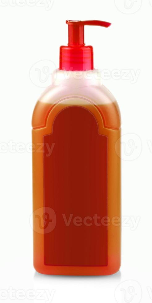 rote Flasche mit Shampoo mit Spender auf weißem Hintergrund foto