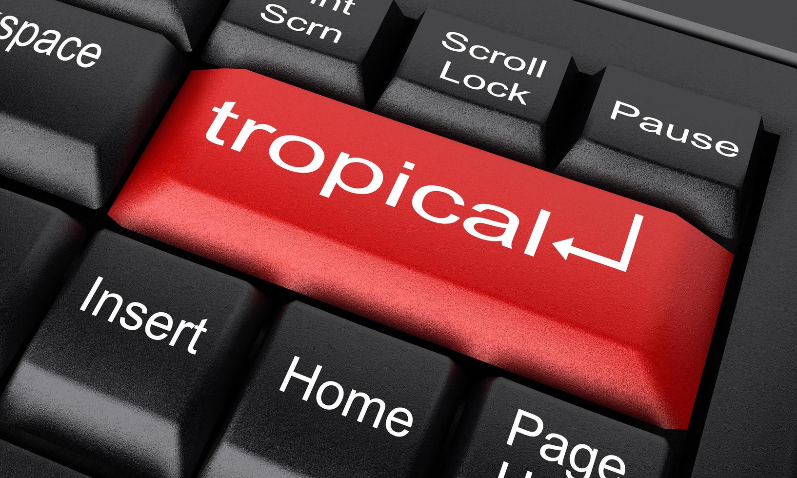 tropisches Wort auf roter Tastaturtaste foto