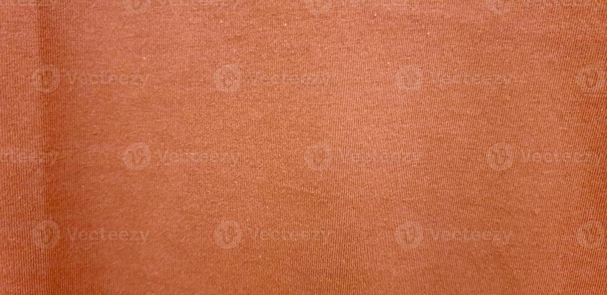 Orange gewebte weiche Stoffstruktur. orangefarbener Baumwollhintergrund. Kopieren Sie Platz für Bild oder Text foto