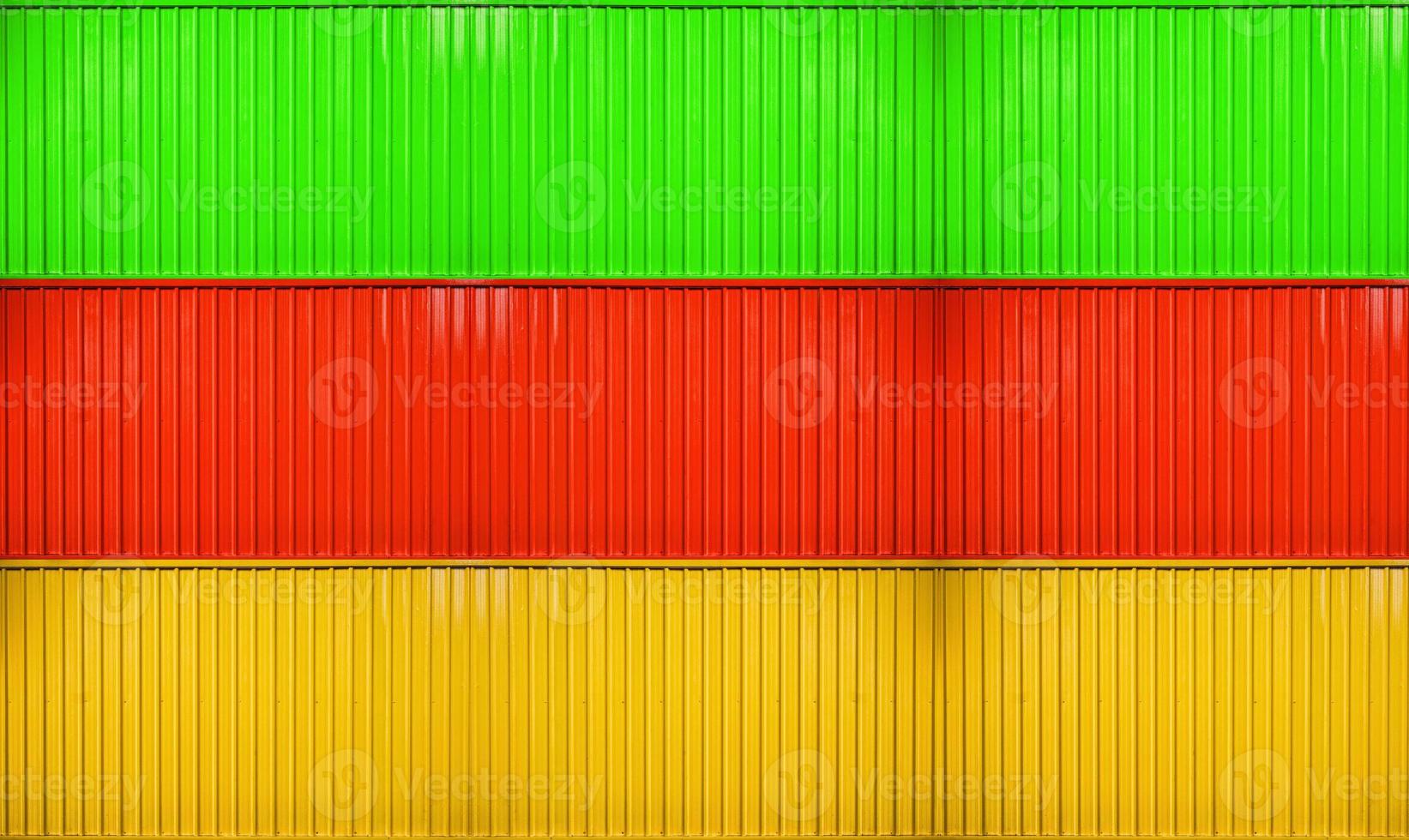 gelber, roter, grüner Kastenstapel der gestreiften Oberflächenbeschaffenheit des Behälters foto