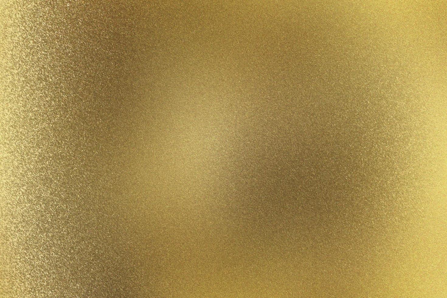 gebürstete goldmetallwand, abstrakter texturhintergrund foto