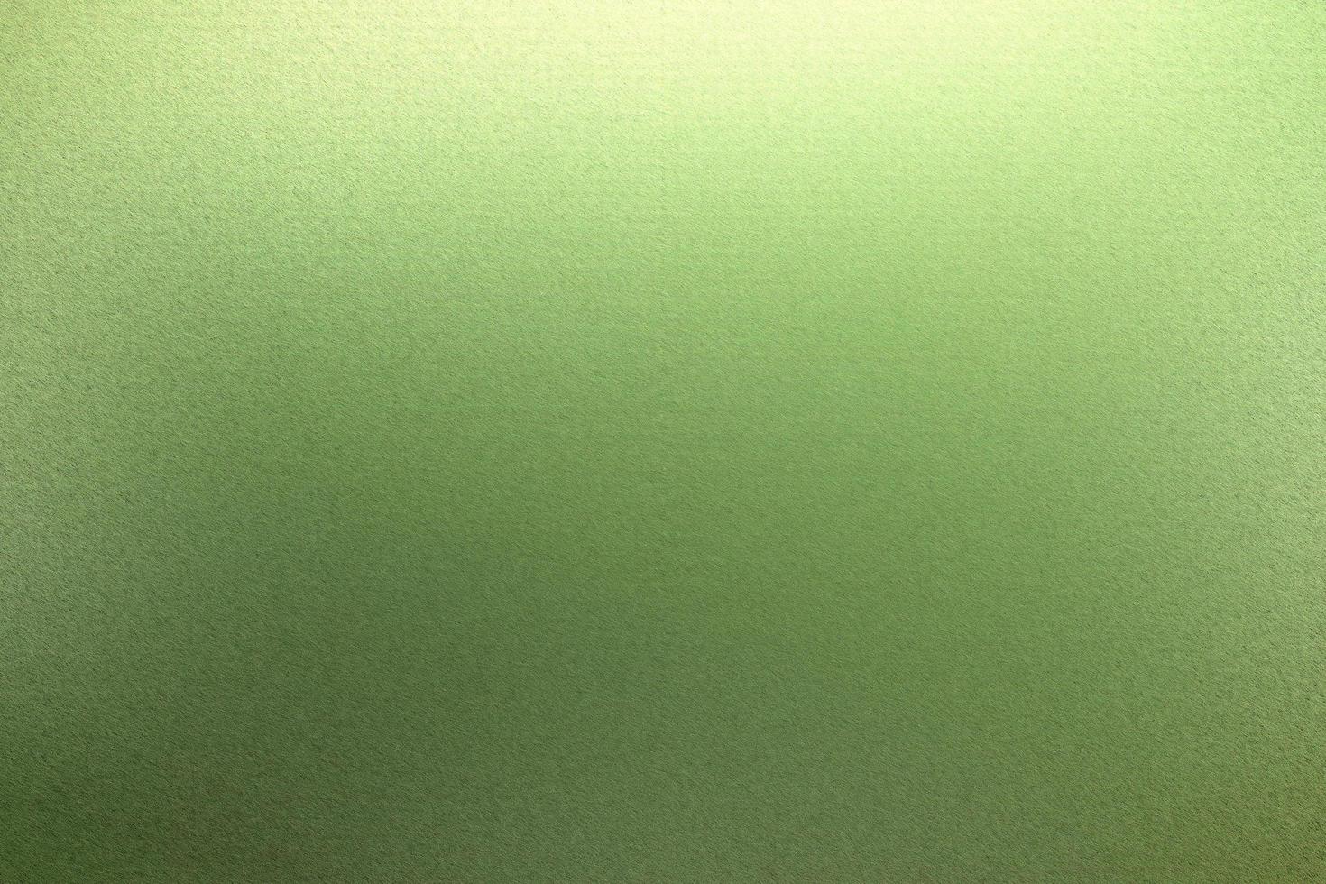 gebürstete grüne Metallwand mit zerkratzter Oberfläche, abstrakter Texturhintergrund foto