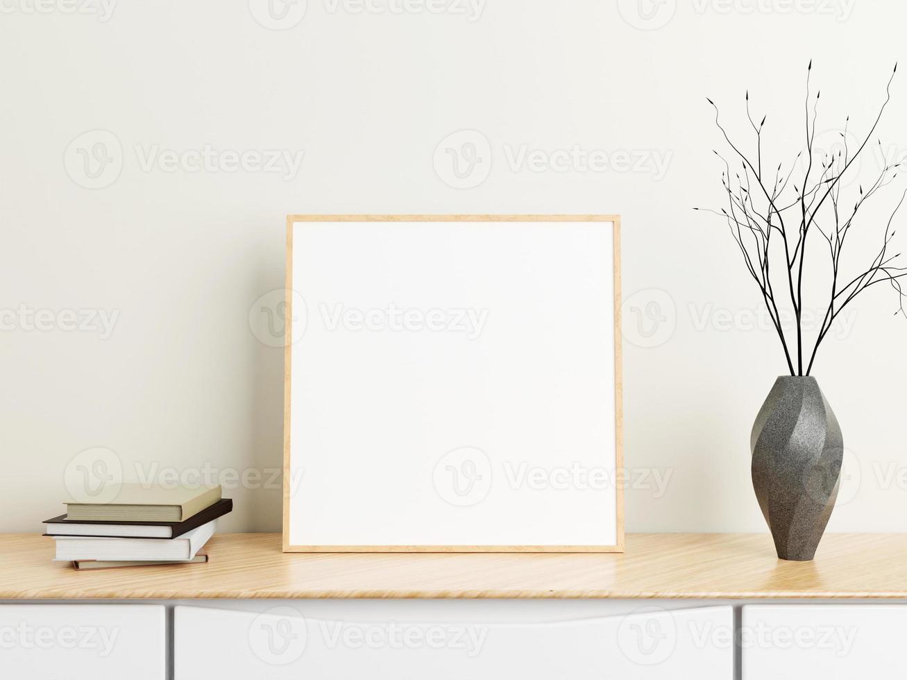 minimalistisches quadratisches holzplakat oder fotorahmenmodell auf holztisch mit büchern und vase in einem raum. 3D-Rendering. foto