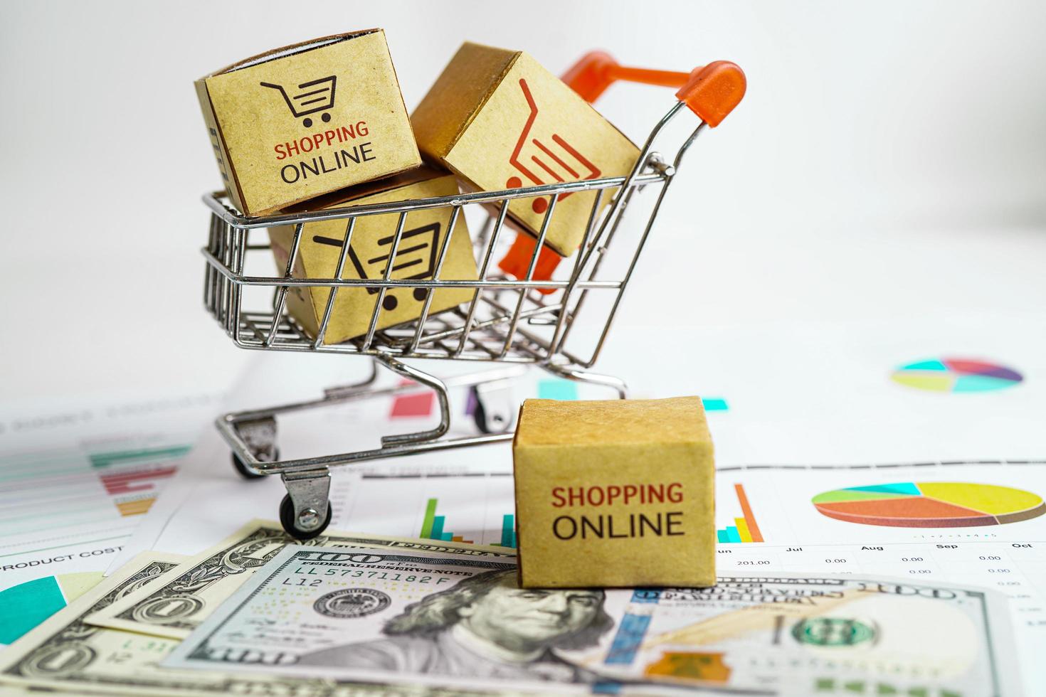 online-shopping, einkaufswagenbox mit geld, import export, finanzhandel. foto