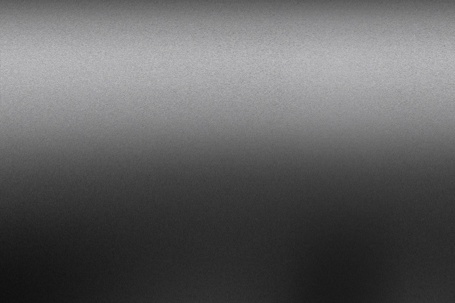 Textur aus schwarzem Metall im dunklen Hintergrund foto