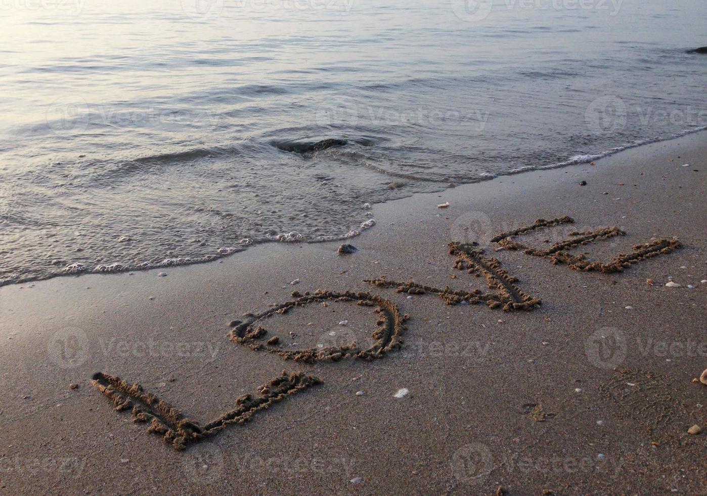 Strand Meerwasser am Strand auf Sand geschrieben, Liebe foto