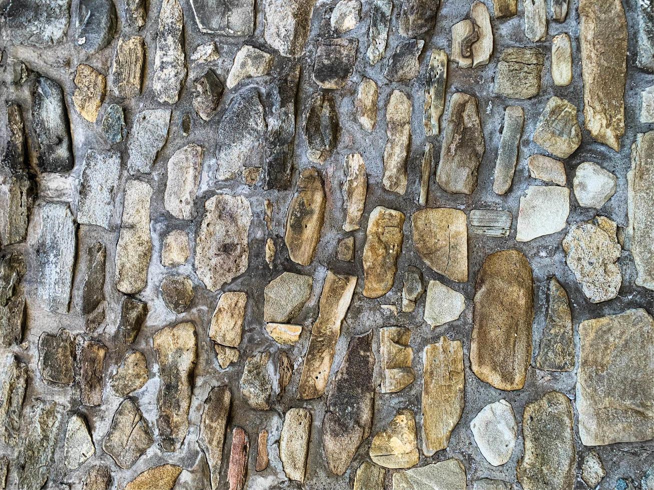 Hintergrund der alten Steinmauer. steinerne Kulisse foto