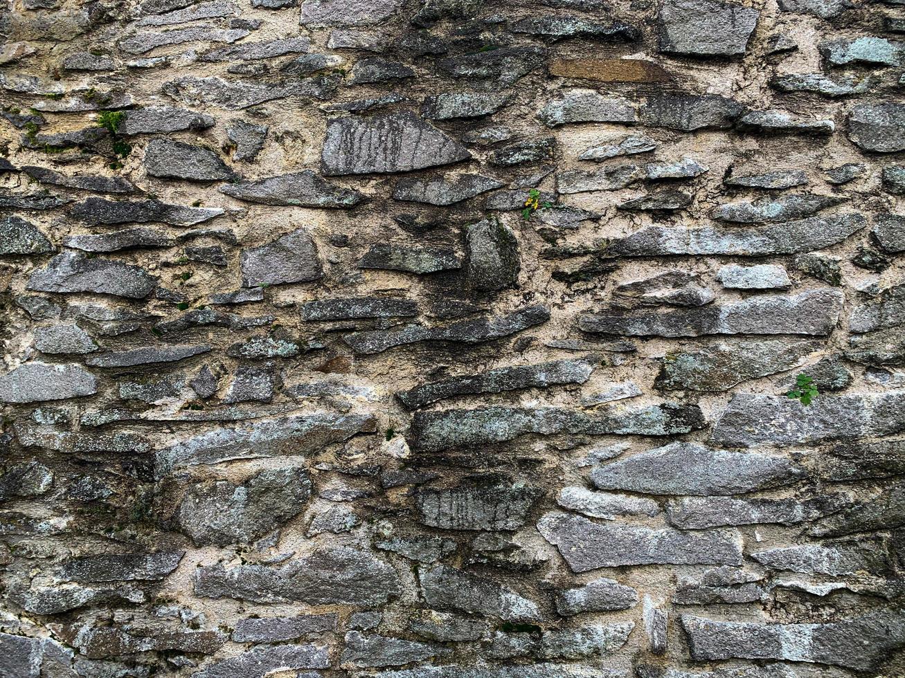 Hintergrund der alten Steinmauer. steinerne Kulisse foto