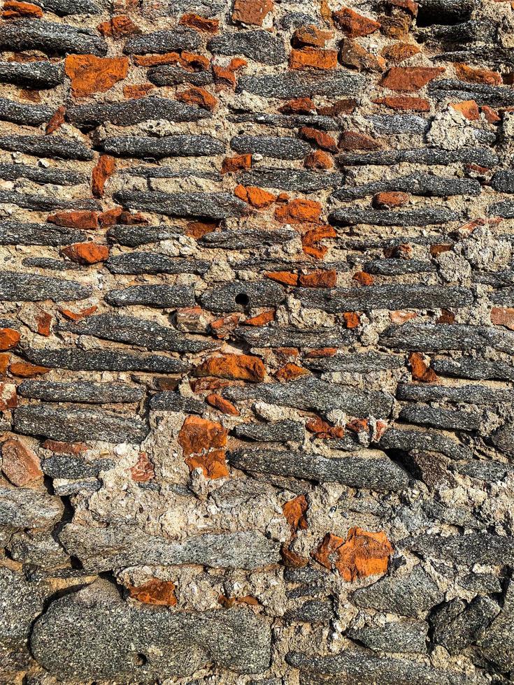 Hintergrund der alten Steinmauer. steinerne Kulisse foto