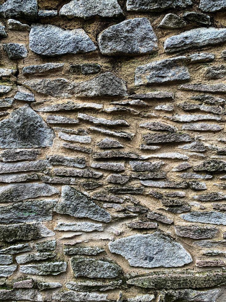 Hintergrund der alten Steinmauer. steinerne Kulisse foto