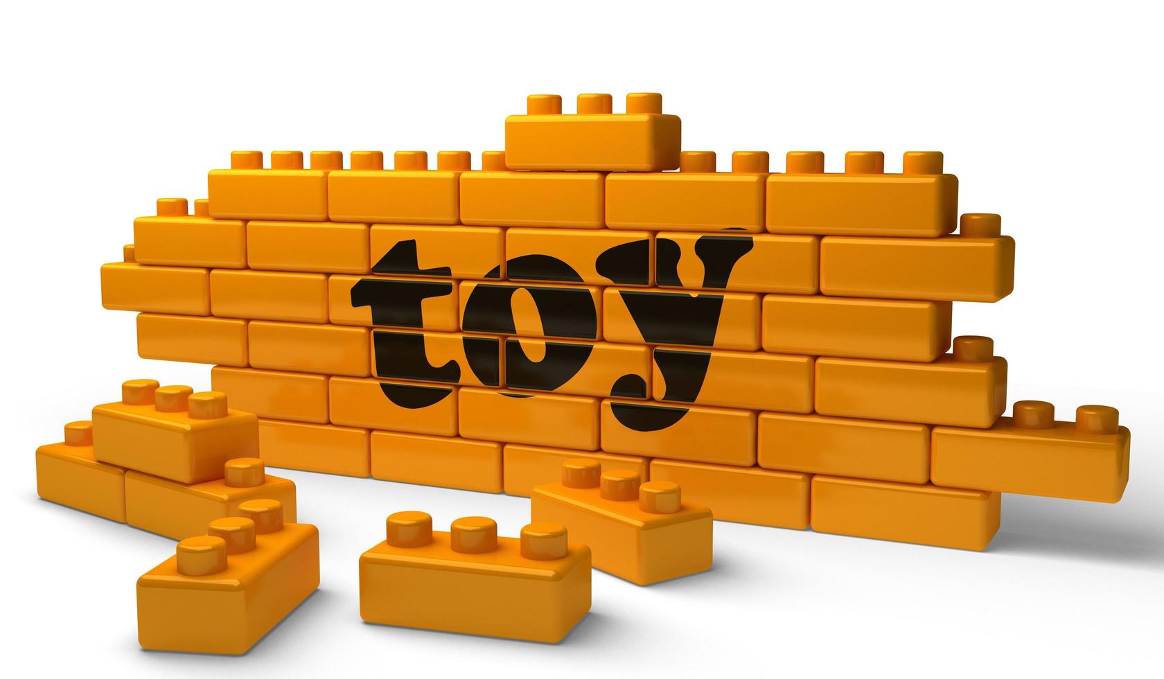Spielzeugwort auf gelber Backsteinmauer foto