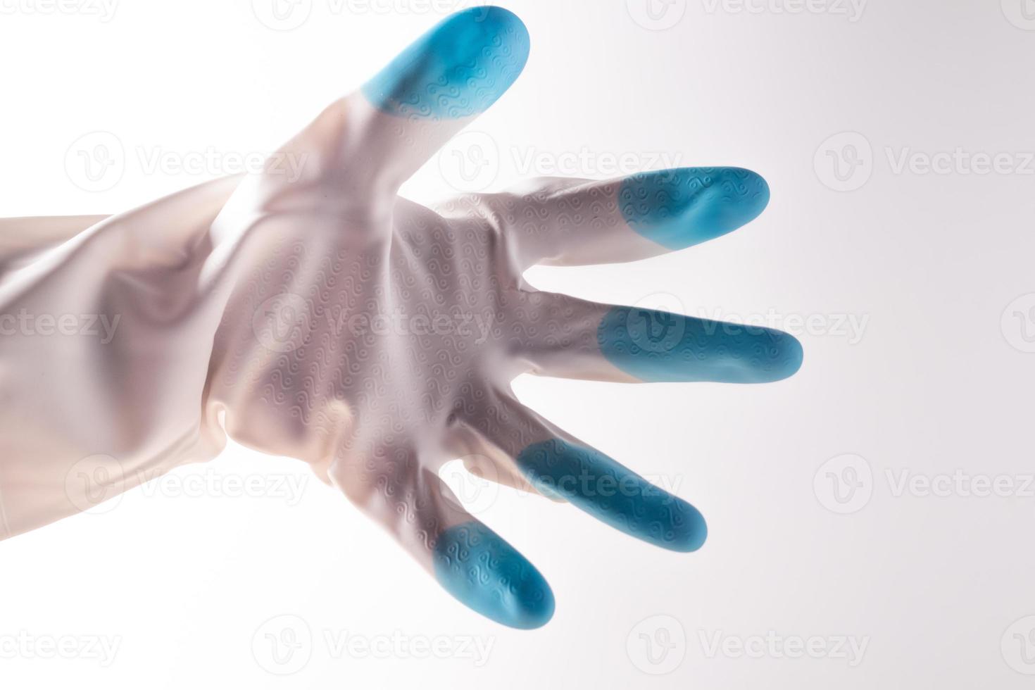 weiße blaue Gummihandschuhe auf weißem Hintergrund foto