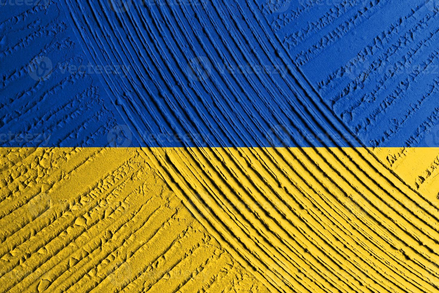 ukrainische staatsflagge. textur konkrete grunge wand in gelb-blauer farbe. Staatssymbol der Ukraine und der Ukrainer. ukrainische flagge auf einem betonwandhintergrund. foto