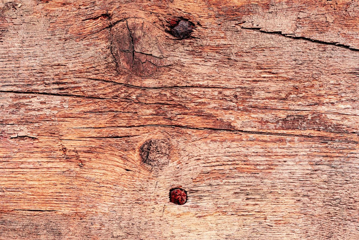 Holzstruktur mit Kratzern und Rissen. es kann als Hintergrund verwendet werden foto