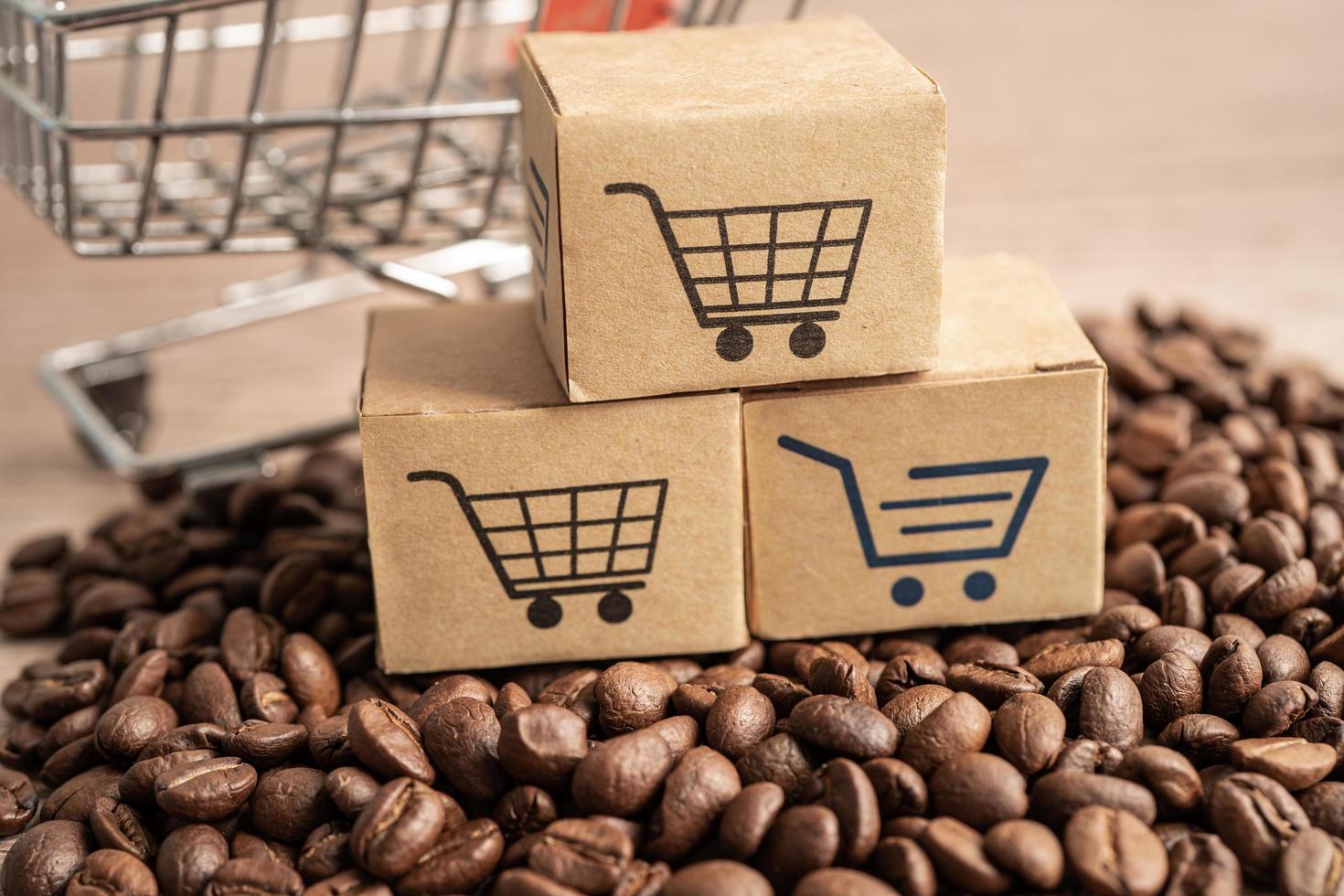 Box mit Einkaufswagen-Logo-Symbol auf Kaffeebohnen, Import-Export-Shopping online oder E-Commerce-Lieferservice-Shop-Produktversand, Handel, Lieferantenkonzept. foto