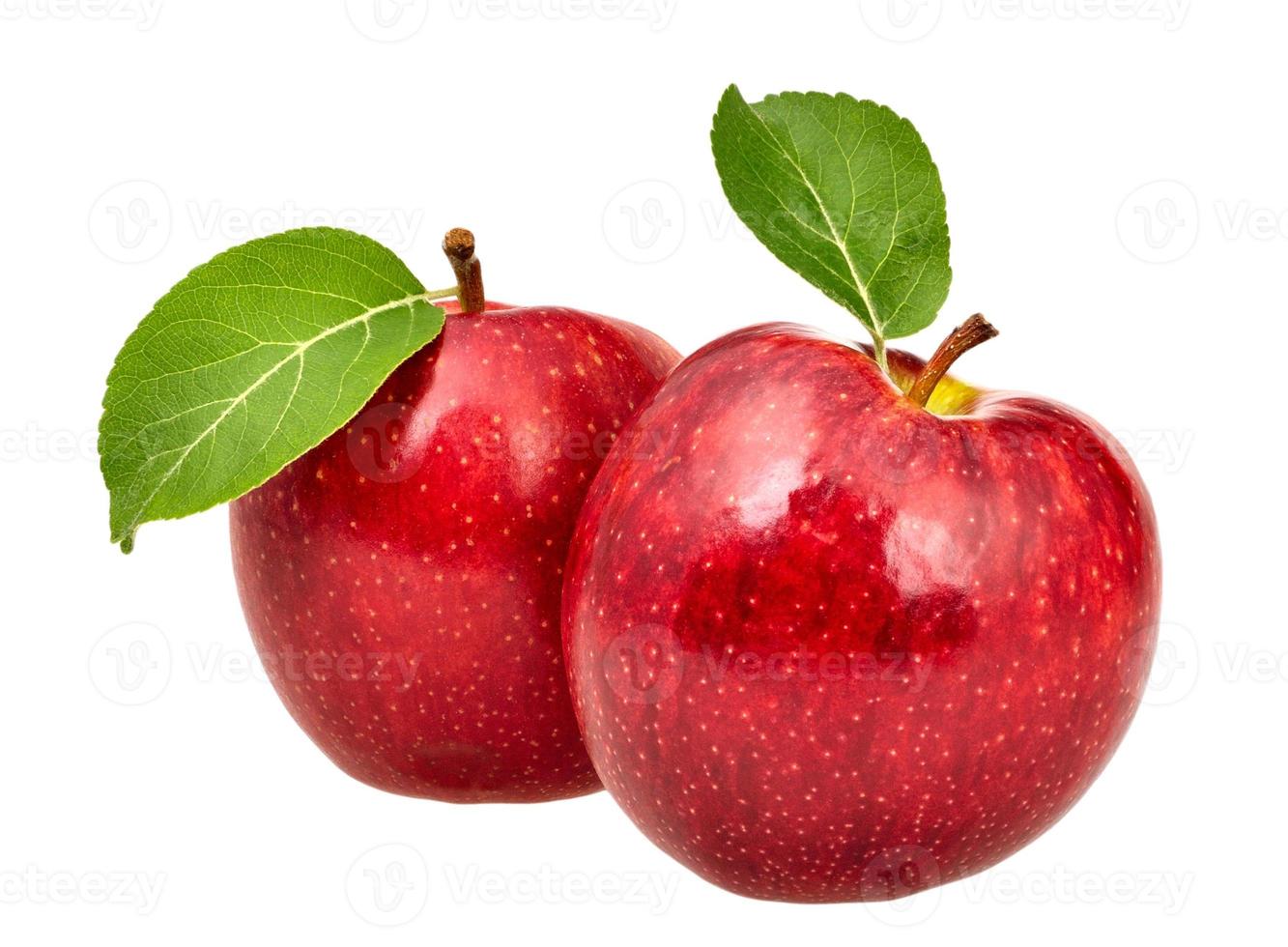 zwei rote Äpfel mit Blättern foto