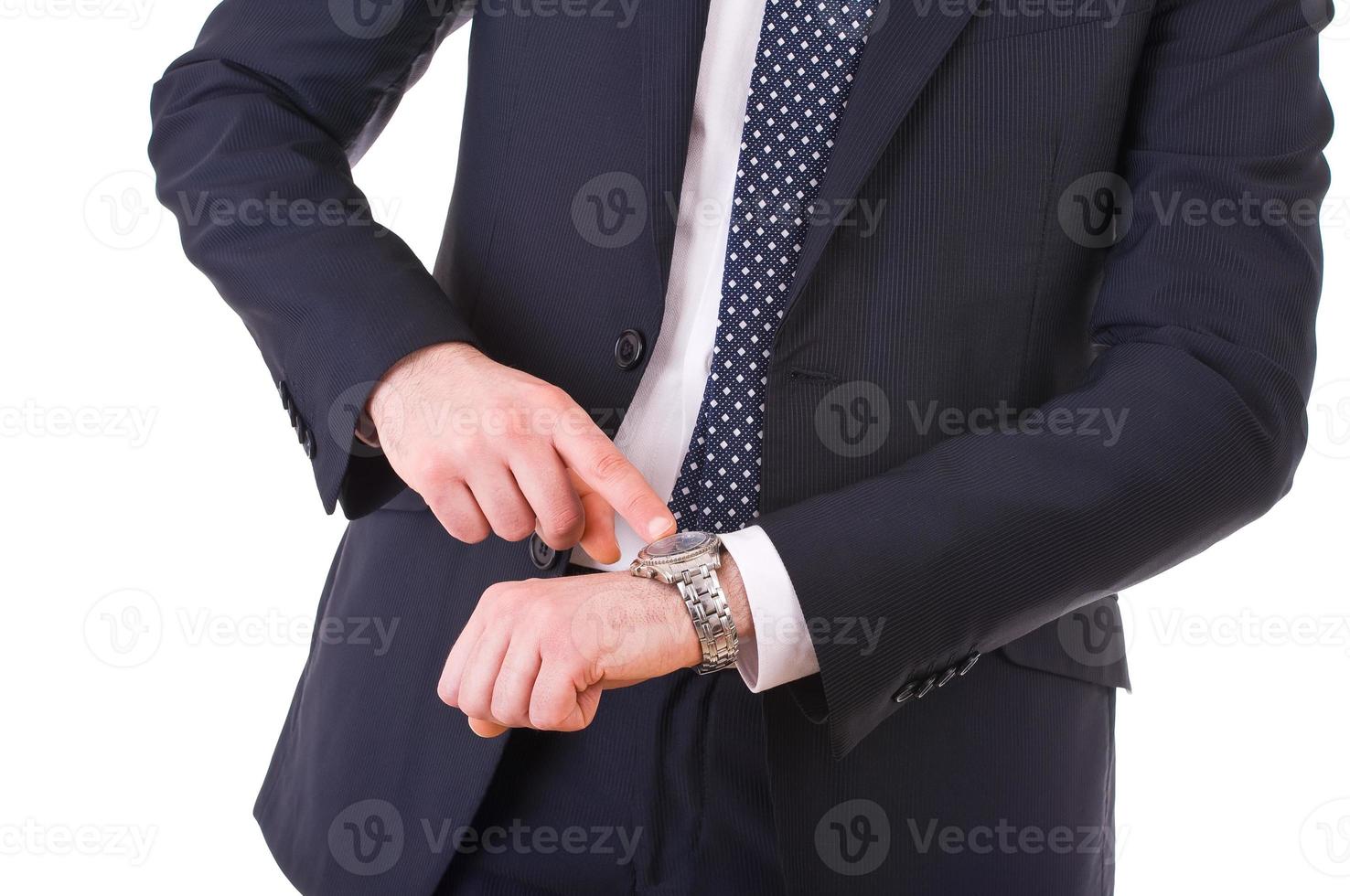 Geschäftsmann zeigt auf seine Armbanduhr. foto